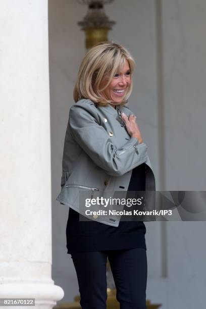 Brigitte Trogneux, Emmanuel Macron's wife, welcomes Bono , singer of U2 and cofounder of the NGO One, as he arrives to meet French President at the...