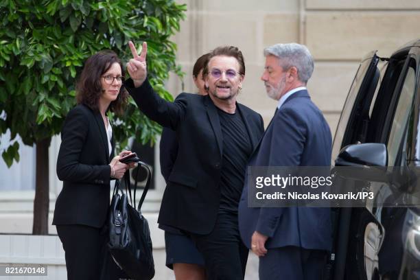 Bono , singer of U2 and cofounder of the NGO One, leaves after a meeting with French President Emmanuel Macron at the Elysee Palace on July 24, 2017...