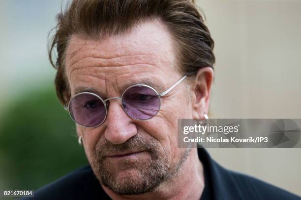 Bono, singer of U2 and cofounder of the NGO One, arrives to meet French President Emmanuel Macron at the Elysee Palace on July 24, 2017 in Paris,...