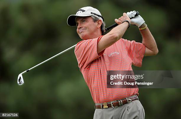 Mark McNulty of Ireland watches his tee shot on the 12th hole during the final round as he finished third in the 2008 US Senior Open Championship at...