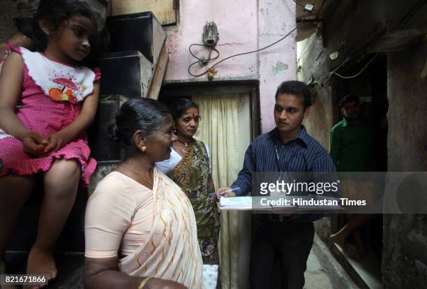 Bhupesh Tayade a census enumerator at Bhoiwada in Mumbai on Tuesday .