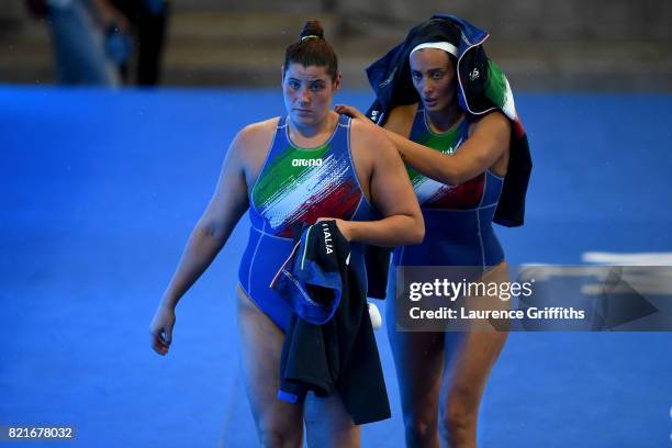 Dejected Italy players leave the arena following their team's 9-8 defeat during the Women's Water Polo Quarter final against Russia on day eleven of...