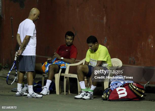 Leander Paes and Mahesh Bhupati practice at Khar Gymkhanna in Mumbai .