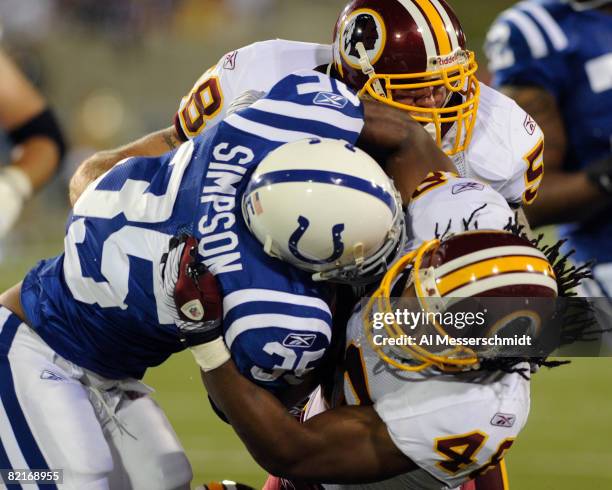 Running back Chad Simpson of the Indianapolis Colts rushes for a gain against the Washington Redskins in the Pro Football Hall of Fame Game at...