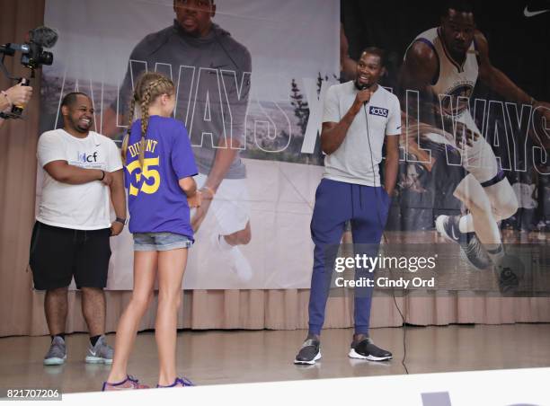 Professional basketball player Kevin Durant takes a question from a student during the KD Build It and They Will Ball court ceremony on July 24, 2017...