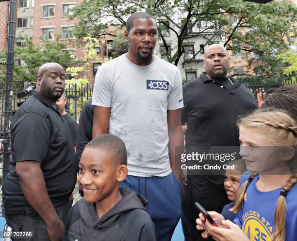 Professional basketball player Kevin Durant enters the basketball court during the KD Build It and They Will Ball court ceremony on July 24, 2017 in...