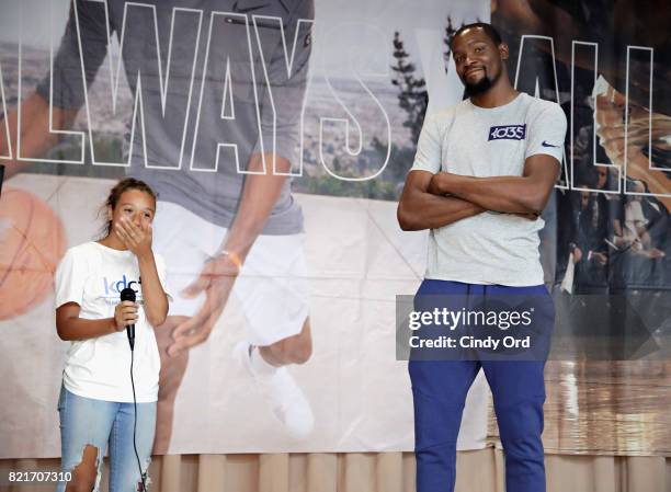 Professional basketball player Kevin Durant takes a question from a student during the KD Build It and They Will Ball court ceremony on July 24, 2017...