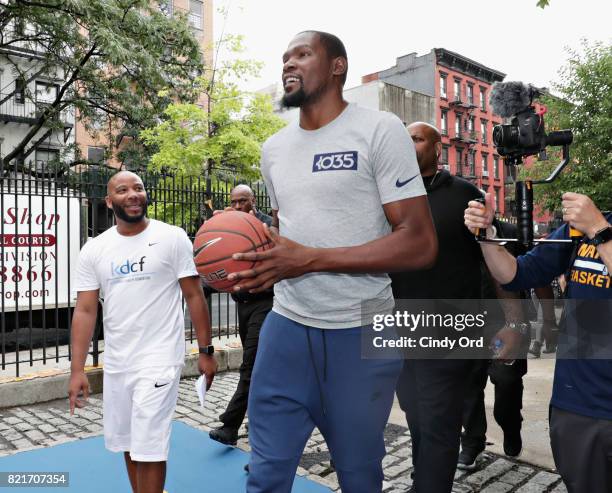 Professional basketball player Kevin Durant enters the basketball court during the KD Build It and They Will Ball court ceremony on July 24, 2017 in...