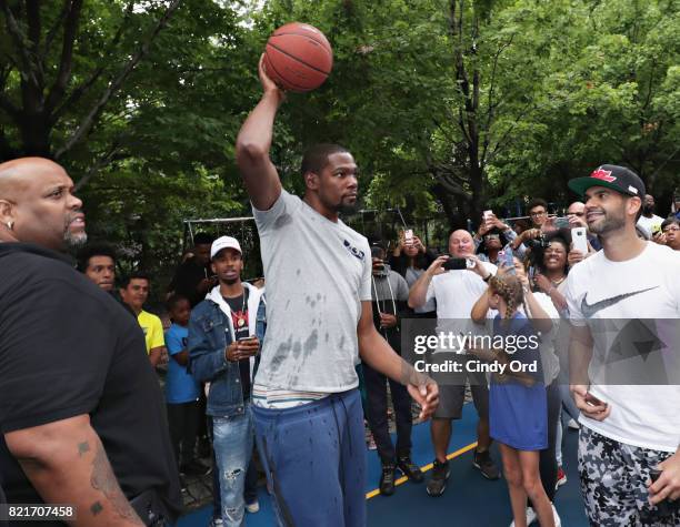 Professional basketball player Kevin Durant enters the basketball court during the KD Build It and They Will Ball court ceremony on July 24, 2017 in...