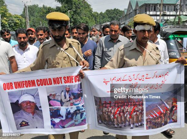 Independent MLA Engineer Rashid got two protesters dressed as injured policemen during his protest march against the beating of policemen by soldiers...