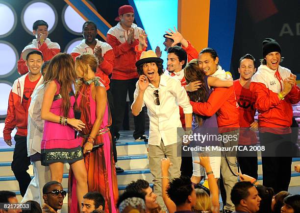 Host Miley Cyrus, singer Fergie, Adam Sevani, Mandy Jiroux and director John M. Chu onstage during the 2008 Teen Choice Awards at Gibson Amphitheater...