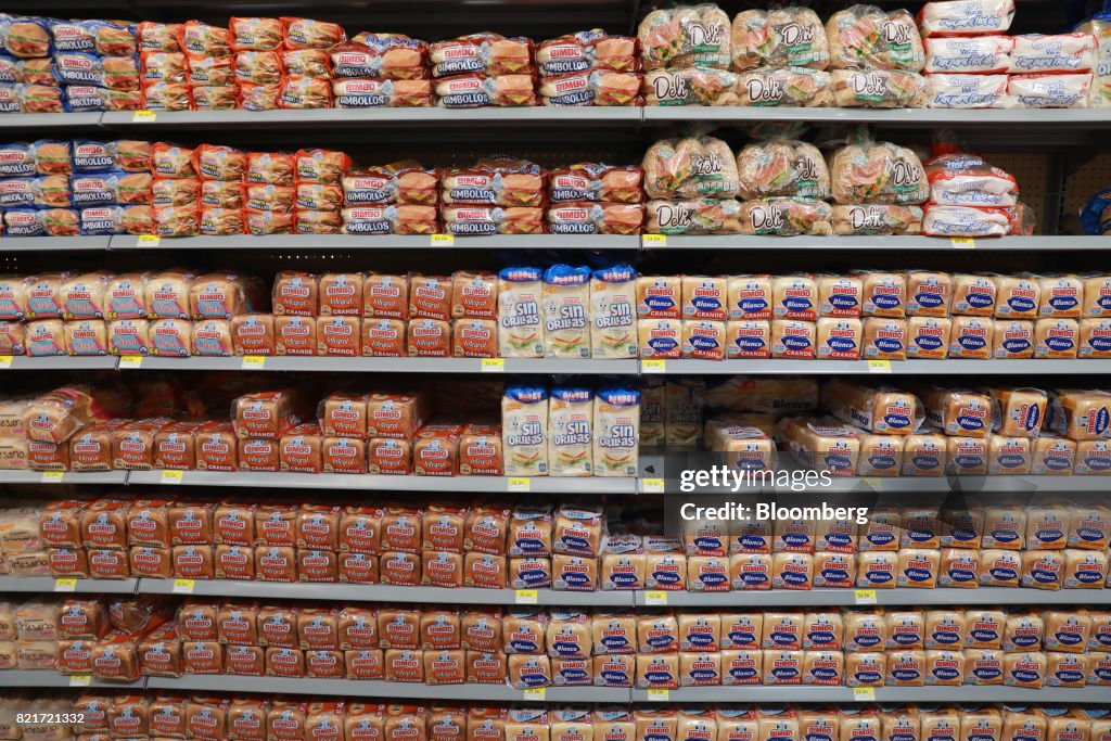 Packages of Grupo Bimbo SAB brand bread sit on display for sale at