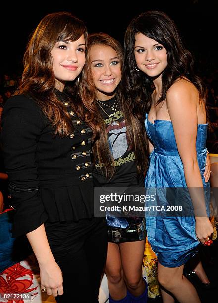 Host Miley Cyrus with Demi Lovato and Selena Gomez during the 2008 Teen Choice Awards at Gibson Amphitheater on August 3, 2008 in Los Angeles,...