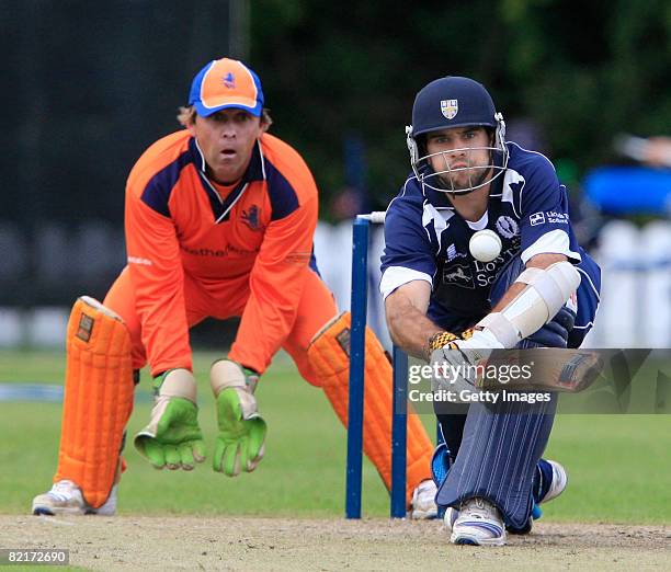 Kyle Coetzer of Scotland bats as J. Smits of the Netherlands look on during the Netherlands v Scotland ICC World Twenty20 Cup Qualifier on August 4,...