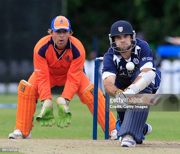 Kyle Coetzer of Scotland bats as J. Smits of the Netherlands look on during the Netherlands v Scotland ICC World Twenty20 Cup Qualifier on August 4,...