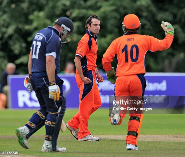 Ryan Ten Doeschate and J. Smits of the Netherlands celebrate after bowling out Ryan Watson of Scotland during the Netherlands v Scotland ICC World...
