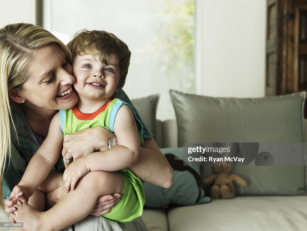 Mother hugging son 