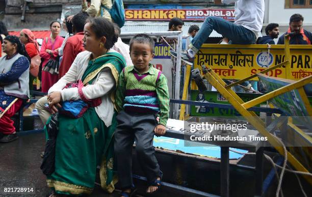 Kid from Nepali community takes part in the protest with her mother outside the Himachal Pradesh Secretariat against rape and murder of teenage girl...