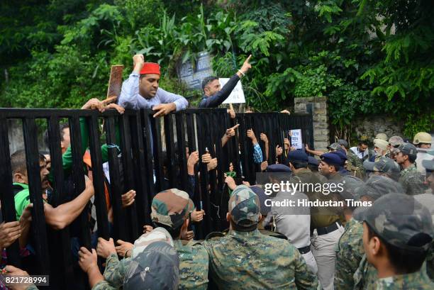 Members of Gudiya Nyay Manch try to cross the barricades during the protest and chakkajam outside the Himachal Pradesh Secretariat against rape and...