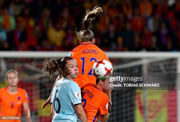 Belgium's midfielder Tine De Caigny and Netherlands' midfielder Sherida Spitse head the ball during the UEFA Women's Euro 2017 football match between...