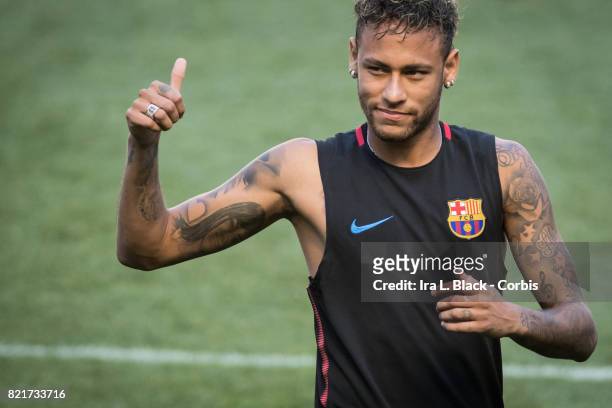 Neymar of Barcelona gives fans a thumbs up during the International Champions Cup FC Barcelona training session prior to the match between FC...