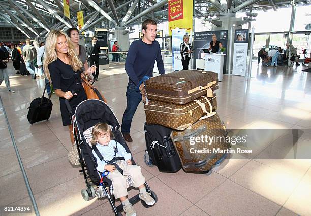 Rafael van der Vaart poses with his wife Sylvie and son Damian at the Hamburg Airport on August 4, 2008 in Hamburg, Germany. Rafael van der Vaart...