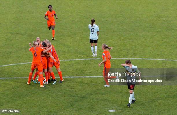 Sherida Spitse of Netherlands celebrate with her team mates after she scores the opening goal by penalty kick during the Group A match between...