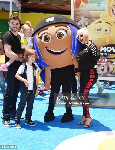 Singer/actress Christina Aguilera, Matthew Rutler and family arrive at the Premiere Of Columbia Pictures And Sony Pictures Animation's 'The Emoji...