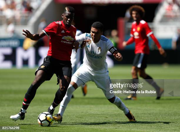 Luka Modric of Real Madrid and Paul Pogba compete for the ball during the International Champions Cup 2017 match between Real Madrid v Manchester...