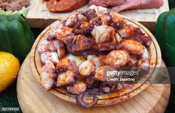 octopus ration in a buffet - pulpo fotografías e imágenes de stock