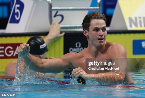 Benjamin Proud of Great Britain celebrates winning the final of Men's 50m Butterfly on day eleven of the FINA World Championships at the Duna Arena...