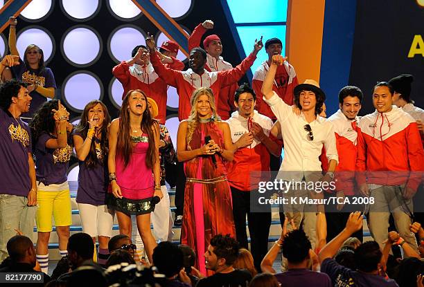 Host Miley Cyrus, Fergie and Adam Sevani onstage during the 2008 Teen Choice Awards at Gibson Amphitheater on August 3, 2008 in Los Angeles,...