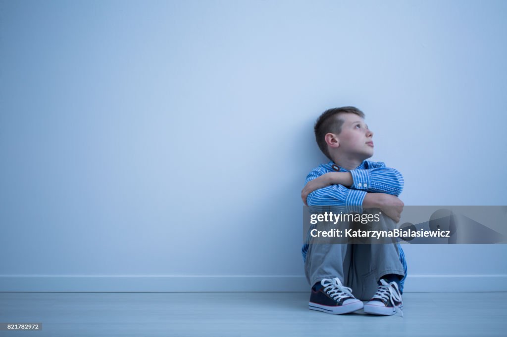 Child sitting on a floor