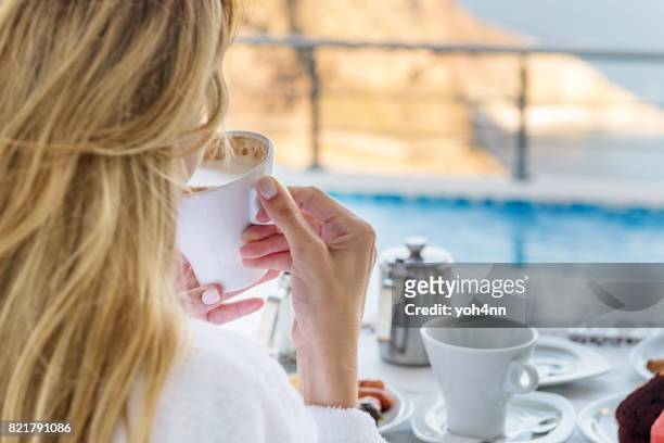woman drinking cappuccino - sea cup stock pictures, royalty-free photos & images