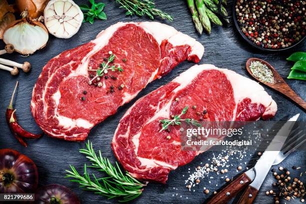 raw fresh beef steak on dark background - corned beef stock pictures, royalty-free photos & images