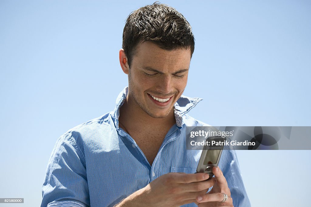 Man texting on mobile phone