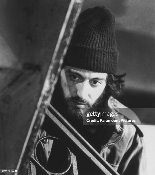 American actor Al Pacino, as officer Frank Serpico, waits in a hallway before apprehending drug dealers in a scene from Sidney Lumet's police...