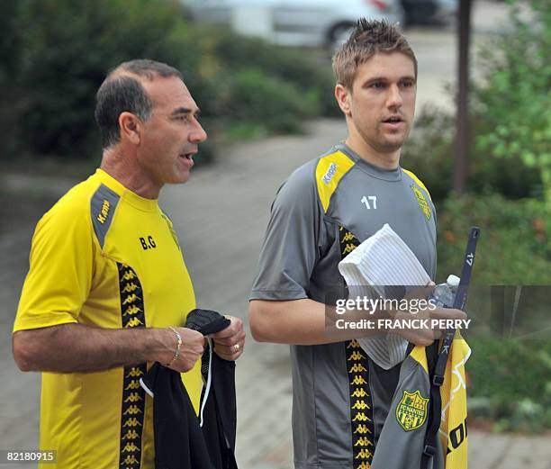 New signing Nantes' football club forward Croatian Yvan Klasnic and assistant coach Baptiste Gentili arrive on August 5 before a training session at...