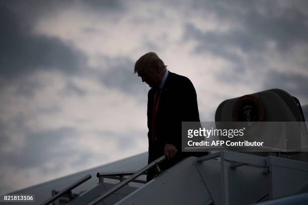 President Donald Trump disembarks from Air Force One upon arrival at Raleigh County Memorial Airport in Beaver, West Virginia, July 24 as Trump...