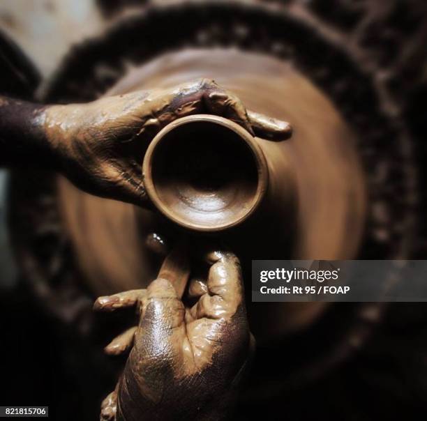 High angle view of potter making pot