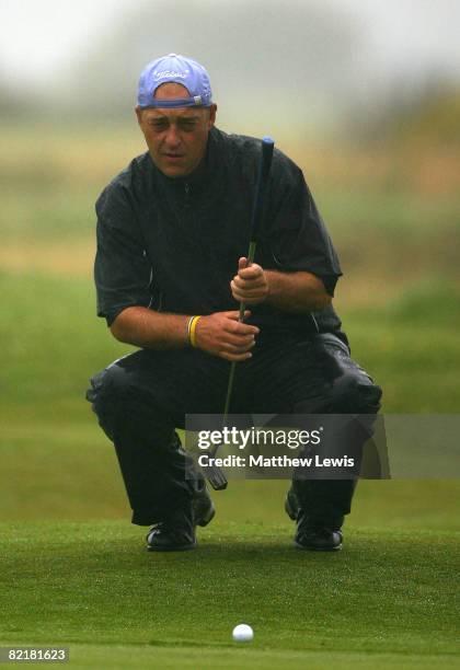 Jon Bevan lines up a putt on the 14th green during the first day of the RCW2010 Welsh Open PGA Championship at the Royal St David's Golf Club on...