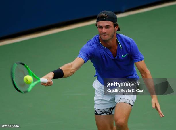 Tommy Paul returns a forehand to Hyeon Chung of South Korea during the BB&T Atlanta Open at Atlantic Station on July 24, 2017 in Atlanta, Georgia.