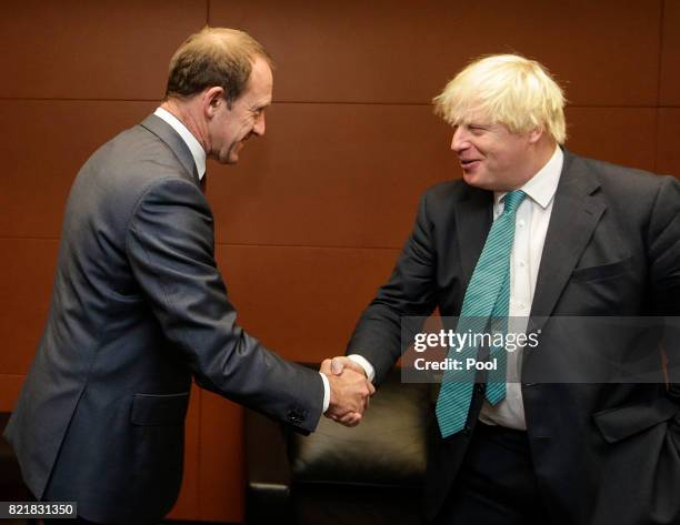 Foreign secretary Boris Johnson shakes hands with Labour leader Andrew Little at Parliament on July 25, 2017 in Wellington, New Zealand. The British...