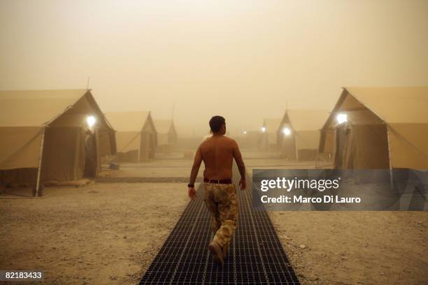 British Army soldier from the 3rd Battalion The Parachute Regiment walks during a sand storm as he prepare to leave for strike operation Southern...