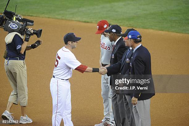 Dustin Pedroia of the Boston Red So greets Chase Utley of the Philadelphia Phillies and Hall of Famers Ryne Sandberg, Bill Mazeroski and Rod Carew...