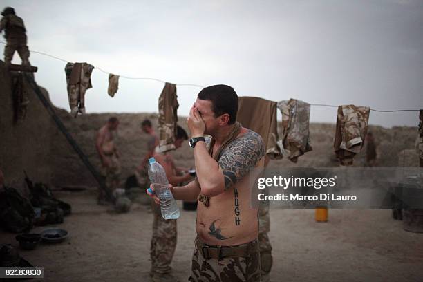 British Army soldier from the 3rd Battalion The Parachute Regiment Cpl David Hutchinson, 34 from Coleraine washes his face during strike operation...