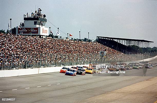 Full field of cars and full grandstands of fans witness racing at Darlington.