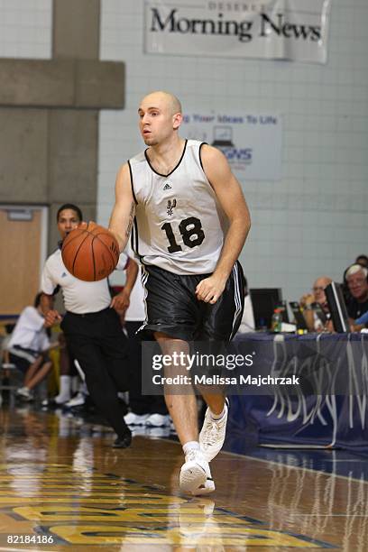 Brian Morrison of the San Antonio Spurs moves the ball up court during a game against the Atlanta Hawks at the Rocky Mountain Review Summer League at...