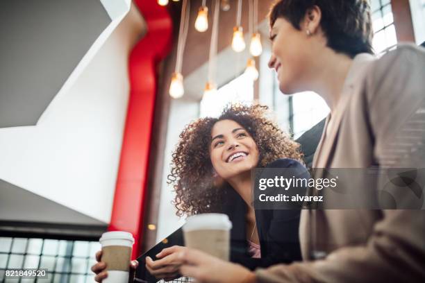 young people taking a coffee break at startup office - business meeting coffee stock pictures, royalty-free photos & images