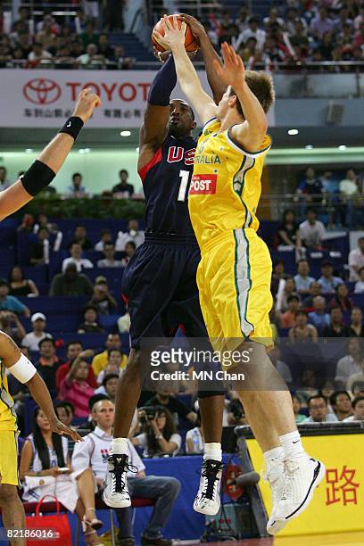 Kobe Bryant of the USA Basketball Men's Senior National Team shoots against Brad Newley of the Australia National Team during the USA Basketball...